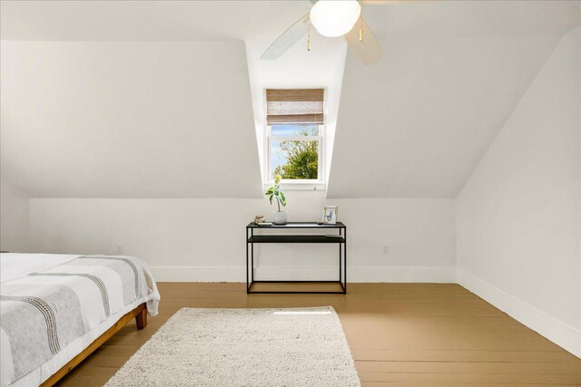 276 N Sedgwick Rd, Sedgwick, ME 04676 - bedroom with wood finished floors, baseboards, a ceiling fan, and lofted ceiling