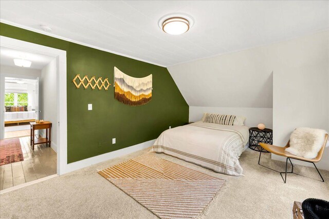 276 N Sedgwick Rd, Sedgwick, ME 04676 - bedroom with carpet floors, baseboards, and lofted ceiling