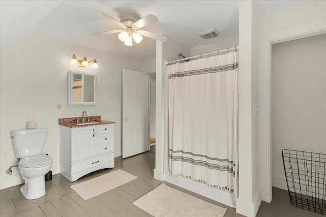 276 N Sedgwick Rd, Sedgwick, ME 04676 - full bathroom featuring vanity, ceiling fan, toilet, and a shower with shower curtain