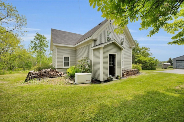276 N Sedgwick Rd, Sedgwick, ME 04676 - view of side of property featuring a yard and roof with shingles