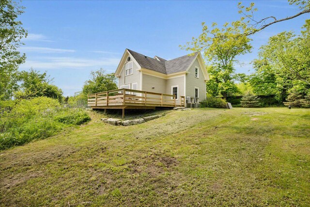 276 N Sedgwick Rd, Sedgwick, ME 04676 - view of home's exterior with a deck and a yard