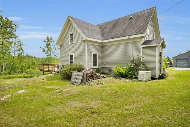276 N Sedgwick Rd, Sedgwick, ME 04676 - rear view of property featuring a shingled roof, a lawn, and a deck
