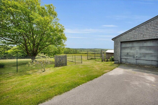 276 N Sedgwick Rd, Sedgwick, ME 04676 - view of yard with asphalt driveway and an outbuilding