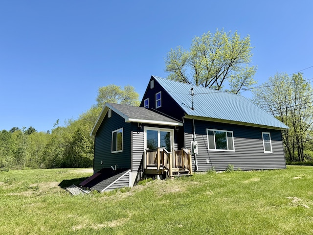 338 River Rd, Bucksport, ME 04416 - back of house featuring a yard