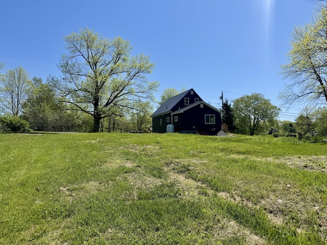 338 River Rd, Bucksport, ME 04416 - view of green lawn featuring an outbuilding and a barn