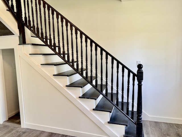 338 River Rd, Bucksport, ME 04416 - staircase featuring wood finished floors and baseboards