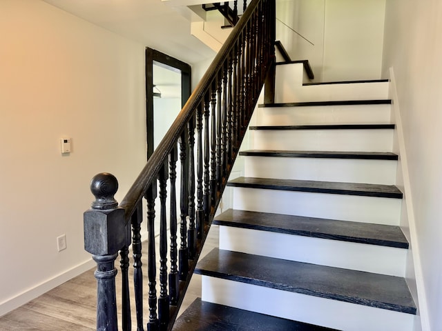 338 River Rd, Bucksport, ME 04416 - staircase with baseboards and wood finished floors