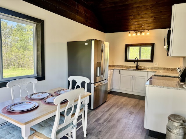 338 River Rd, Bucksport, ME 04416 - kitchen featuring a sink, wood ceiling, stainless steel appliances, healthy amount of natural light, and dark wood-style flooring