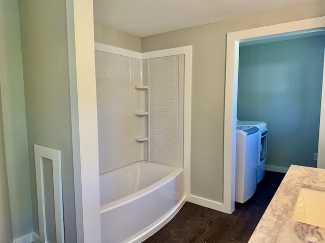 338 River Rd, Bucksport, ME 04416 - bathroom featuring washing machine and clothes dryer, wood finished floors, vanity, baseboards, and toilet