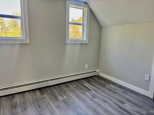 338 River Rd, Bucksport, ME 04416 - additional living space with a baseboard radiator, lofted ceiling, baseboards, and dark wood-style flooring