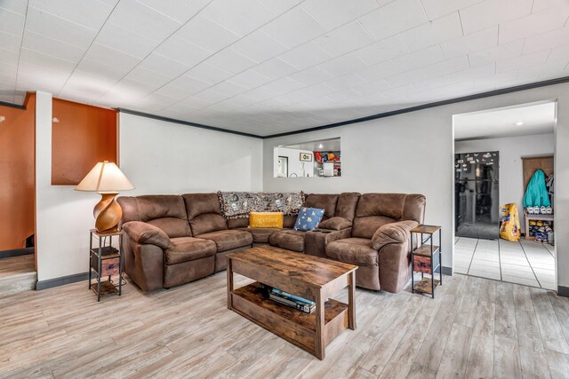 54 Old Canton Rd, Dixfield, ME 04224 - living room with light wood finished floors, crown molding, and baseboards