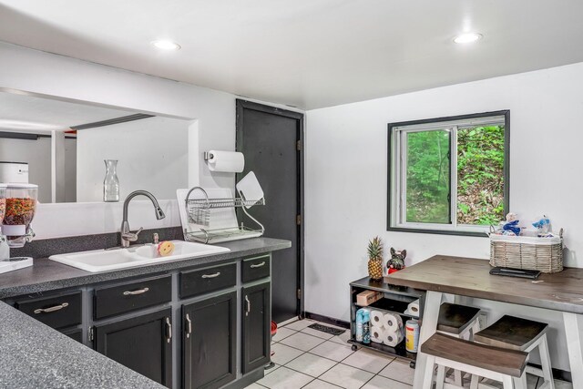 54 Old Canton Rd, Dixfield, ME 04224 - kitchen featuring a sink, light tile patterned flooring, dark cabinetry, dark countertops, and recessed lighting