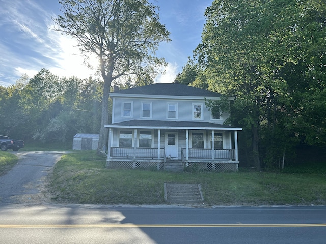 529 Main St, East Machias, ME 04630 - colonial house featuring covered porch and driveway