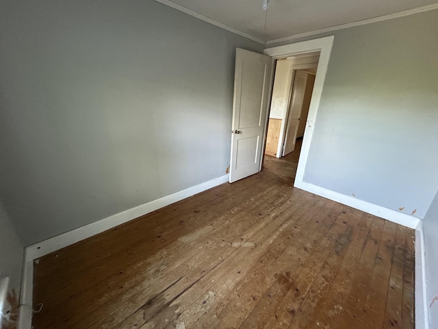 529 Main St, East Machias, ME 04630 - spare room featuring wood-type flooring, crown molding, and baseboards