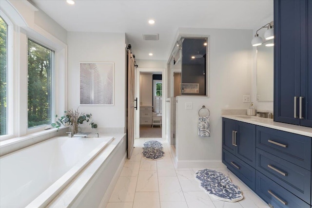 3 Highpointe Cir, Kittery, ME 03904 - full bath with healthy amount of natural light, vanity, marble finish flooring, a garden tub, and recessed lighting