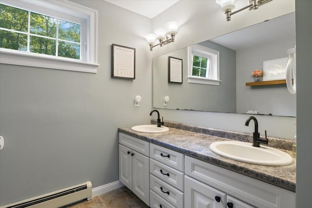 3 Highpointe Cir, Kittery, ME 03904 - bathroom featuring baseboard heating, double vanity, and baseboards
