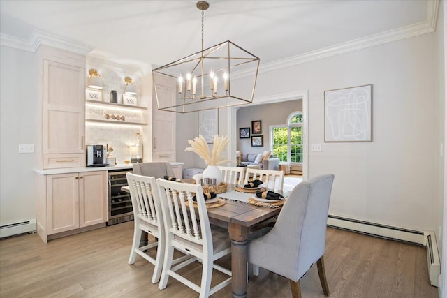 3 Highpointe Cir, Kittery, ME 03904 - dining room with wine cooler, light wood-style flooring, a chandelier, ornamental molding, and a baseboard radiator
