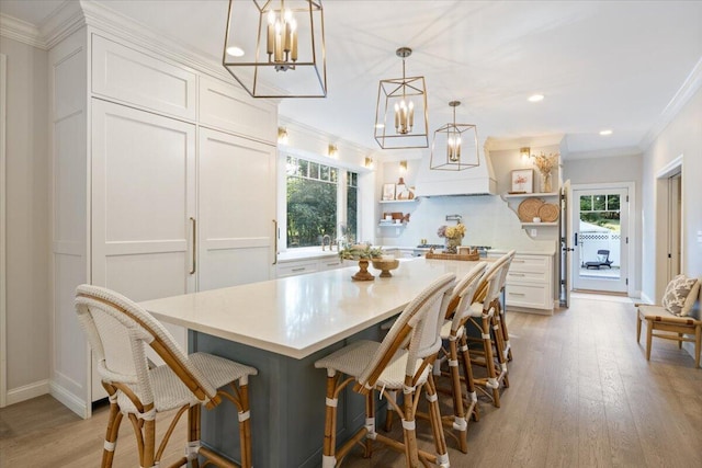 3 Highpointe Cir, Kittery, ME 03904 - dining space with a chandelier, healthy amount of natural light, light wood-style floors, crown molding, and recessed lighting