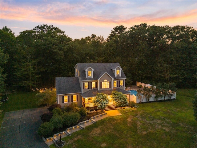 3 Highpointe Cir, Kittery, ME 03904 - view of front of property with a front lawn, an outdoor pool, and a forest view
