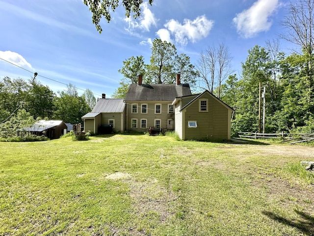 13 Mountain Rd, Newfield, ME 04095 - back of property featuring a chimney and a yard