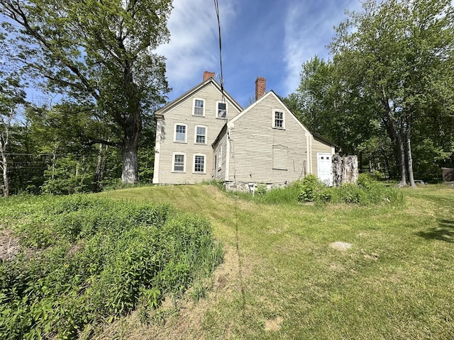13 Mountain Rd, Newfield, ME 04095 - back of property with a chimney and a lawn