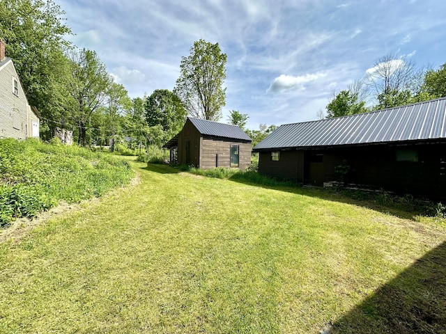 13 Mountain Rd, Newfield, ME 04095 - view of grassy yard with an outbuilding and a pole building