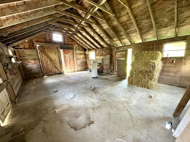 13 Mountain Rd, Newfield, ME 04095 - misc room featuring vaulted ceiling, concrete flooring, and wood walls