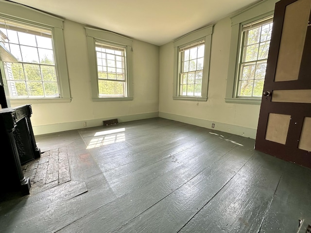 13 Mountain Rd, Newfield, ME 04095 - unfurnished room featuring baseboards, hardwood / wood-style floors, and a fireplace