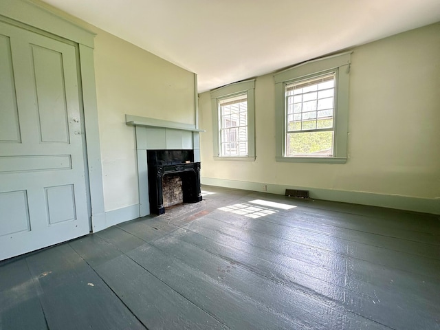 13 Mountain Rd, Newfield, ME 04095 - unfurnished living room featuring a fireplace, dark wood-style floors, and baseboards