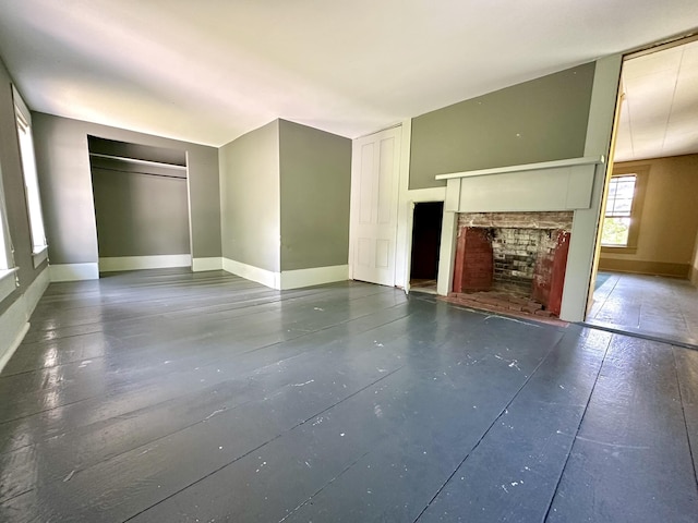 13 Mountain Rd, Newfield, ME 04095 - unfurnished living room with a fireplace and baseboards