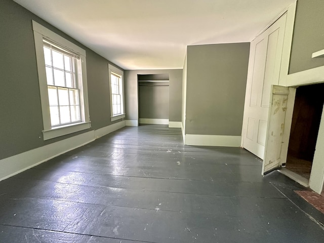 13 Mountain Rd, Newfield, ME 04095 - unfurnished bedroom with a closet, hardwood / wood-style flooring, and baseboards