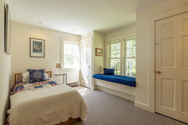 250 Davis Point Rd, Cushing, ME 04563 - bedroom with a baseboard heating unit, multiple windows, and carpet