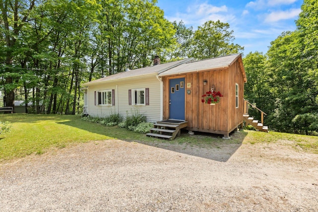 43 Vista Dr, Windham, ME 04062 - view of front of home with a chimney and a front lawn