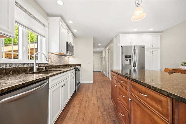 64 New Settlement Rd, Hiram, ME 04041 - kitchen with appliances with stainless steel finishes, dark wood-type flooring, white cabinets, dark stone countertops, and recessed lighting
