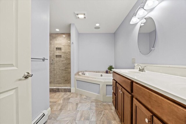 64 New Settlement Rd, Hiram, ME 04041 - full bathroom with baseboard heating, a stall shower, a garden tub, and double vanity
