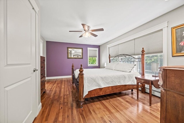 64 New Settlement Rd, Hiram, ME 04041 - bedroom featuring light wood-style flooring, baseboard heating, and ceiling fan