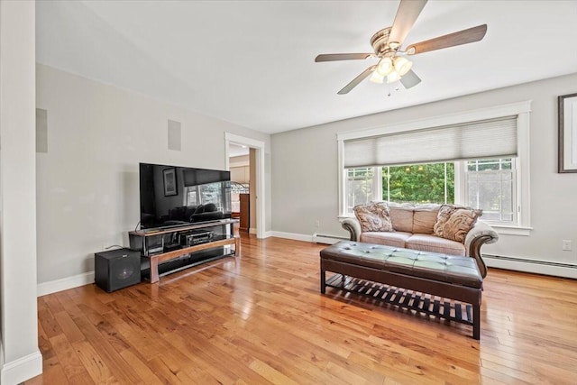 64 New Settlement Rd, Hiram, ME 04041 - living room featuring a baseboard heating unit, light wood-style floors, and a ceiling fan