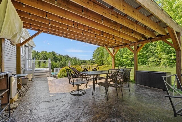 64 New Settlement Rd, Hiram, ME 04041 - view of patio / terrace featuring outdoor dining area and view of scattered trees