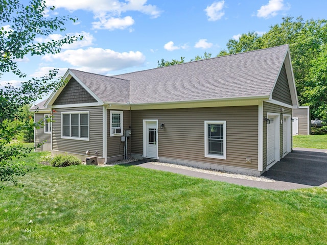 64 New Settlement Rd, Hiram, ME 04041 - view of front of property with a garage, roof with shingles, a front yard, and asphalt driveway