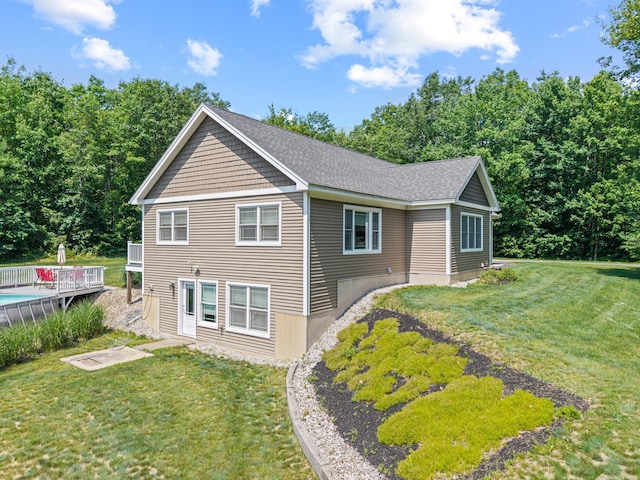 64 New Settlement Rd, Hiram, ME 04041 - rear view of property with a lawn and a deck