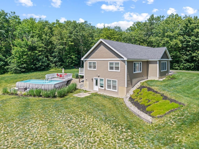 64 New Settlement Rd, Hiram, ME 04041 - back of property featuring an outdoor pool, a yard, and a deck