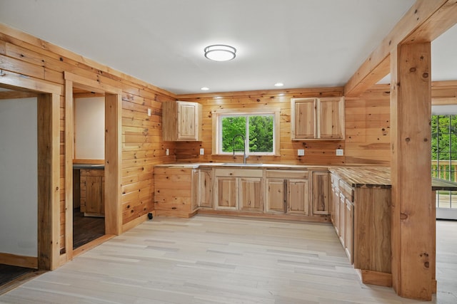 545 Back Rd, Skowhegan, ME 04976 - kitchen with light brown cabinetry, healthy amount of natural light, a sink, wood walls, and recessed lighting