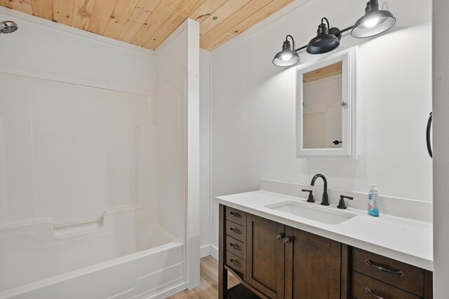 545 Back Rd, Skowhegan, ME 04976 - full bathroom featuring wood ceiling, vanity, shower / bathtub combination, and wood finished floors