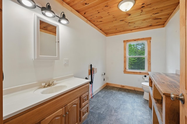545 Back Rd, Skowhegan, ME 04976 - bathroom featuring wooden ceiling, vanity, toilet, and baseboards