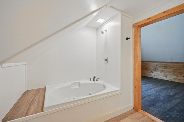 545 Back Rd, Skowhegan, ME 04976 - full bathroom with a jetted tub, wood finished floors, and lofted ceiling