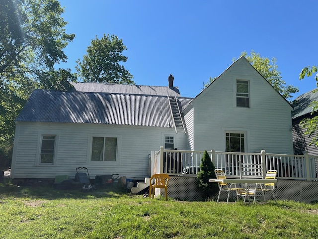 96 French St, Acton, ME 04001 - back of house with a deck, a chimney, metal roof, and a yard
