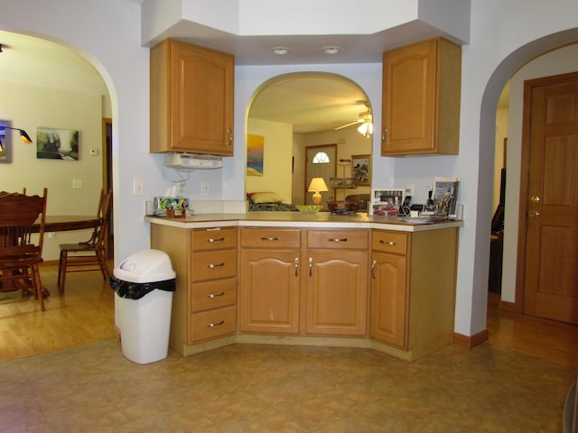 155 Crystal Cv, Waldoboro, ME 04572 - kitchen featuring arched walkways, ceiling fan, and light countertops