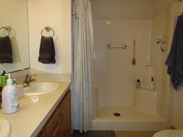 155 Crystal Cv, Waldoboro, ME 04572 - full bathroom featuring double vanity, a shower with shower curtain, and toilet