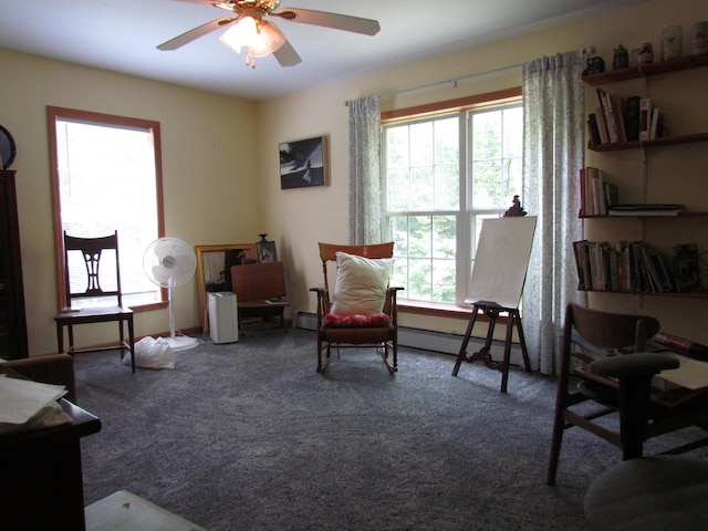 155 Crystal Cv, Waldoboro, ME 04572 - sitting room with plenty of natural light, a baseboard heating unit, ceiling fan, and carpet floors