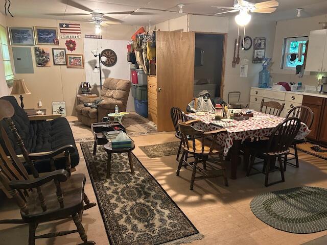 12 Beach View Rd, Dover-Foxcroft, ME 04426 - dining area featuring ceiling fan, electric panel, and light flooring